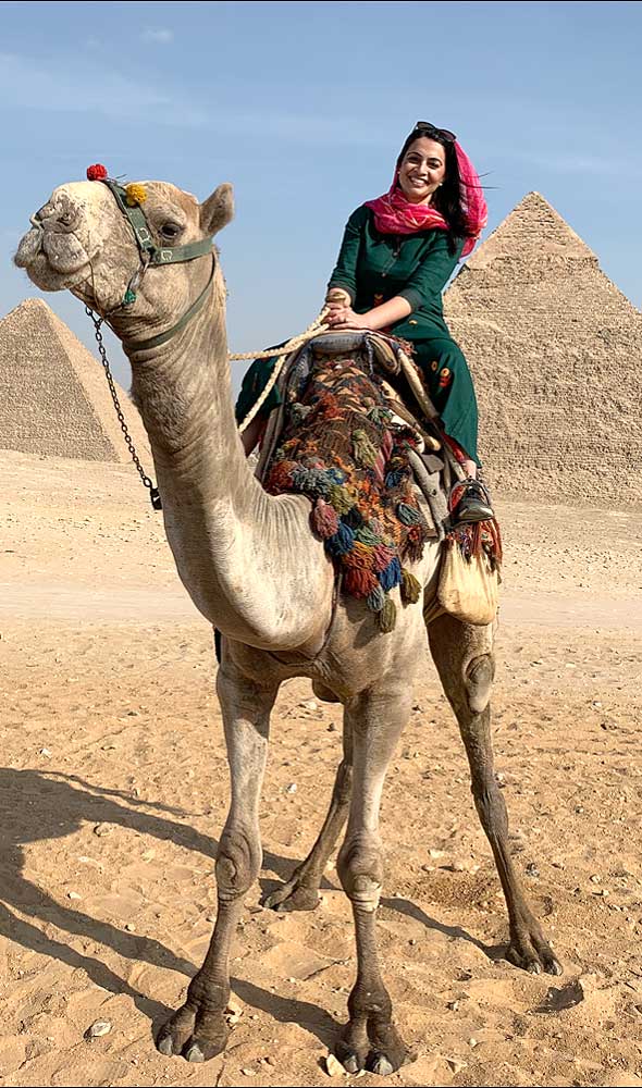 attorney Palvir Shokar on a camel in Egypt.
