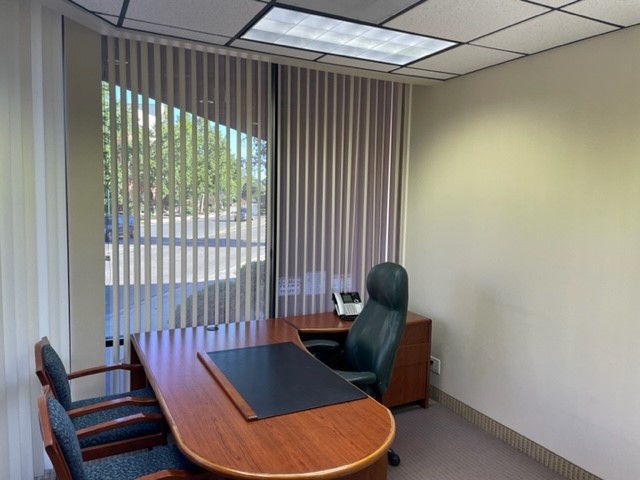 Office for rent, desk with large window