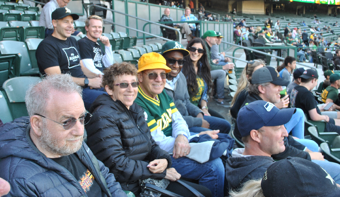 a group of A's fans in the stands at the game on July 26, 2022