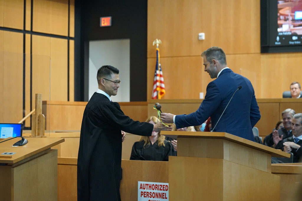 Judge Glenn Kim accepts the gavel from David Erb, President elect of the Contra Costa County Bar Association September 9, 2022