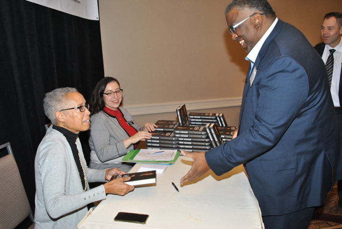 Judge LaDoris Cordell signed a copy of her book for CCCBA member Ray Robinson at the 2022 MCLE Spectacular