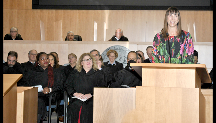 Erin Kingsbury, Deputy DA, Alameda County District Attorney's Office at the poedium while judges from the superior court sit en banc.