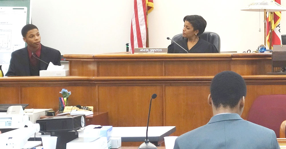 Judge Anita Santos (Ret.) hears a case from a student in Mock Trial