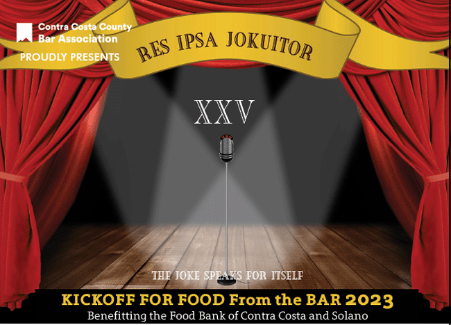 Microphone on stage under banner Res Ipsa Jokuitor (the Joke Speaks for Itself)