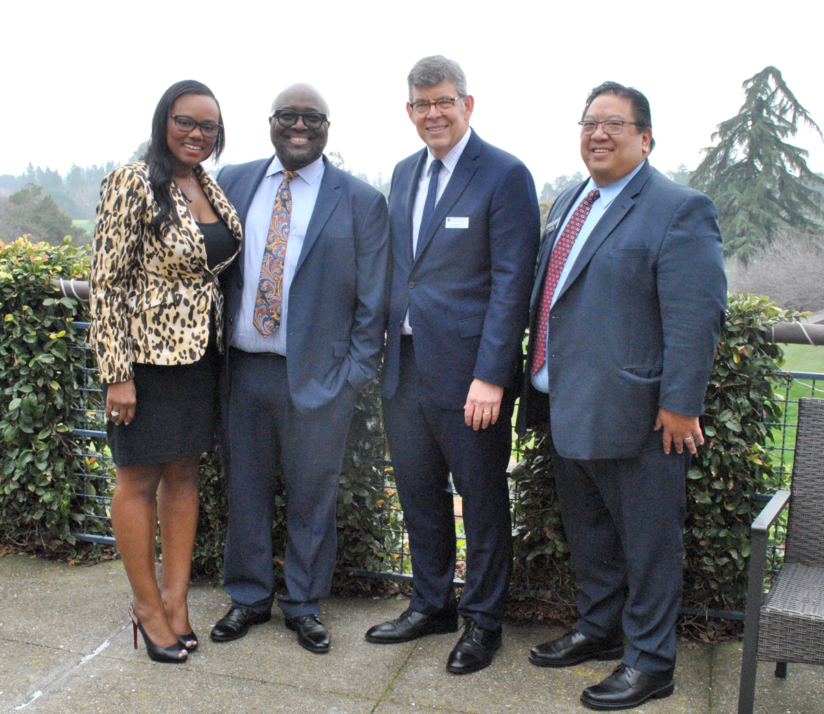 Four people pose outside at CCCBA Installation & Awards luncheon January 19, 2024.